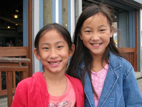 Sisters happy to be eating at Snoopy's under the Causeway to the island. "This is so cool, Mom!"
